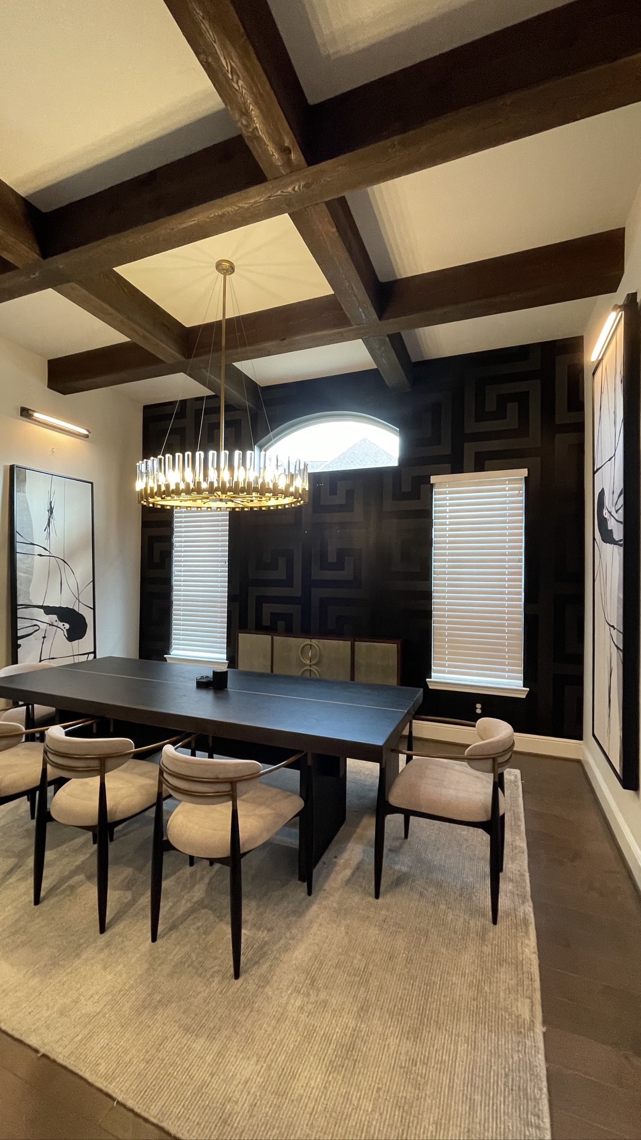 Dark geometric wallpaper installed in a fully furnished formal dining room