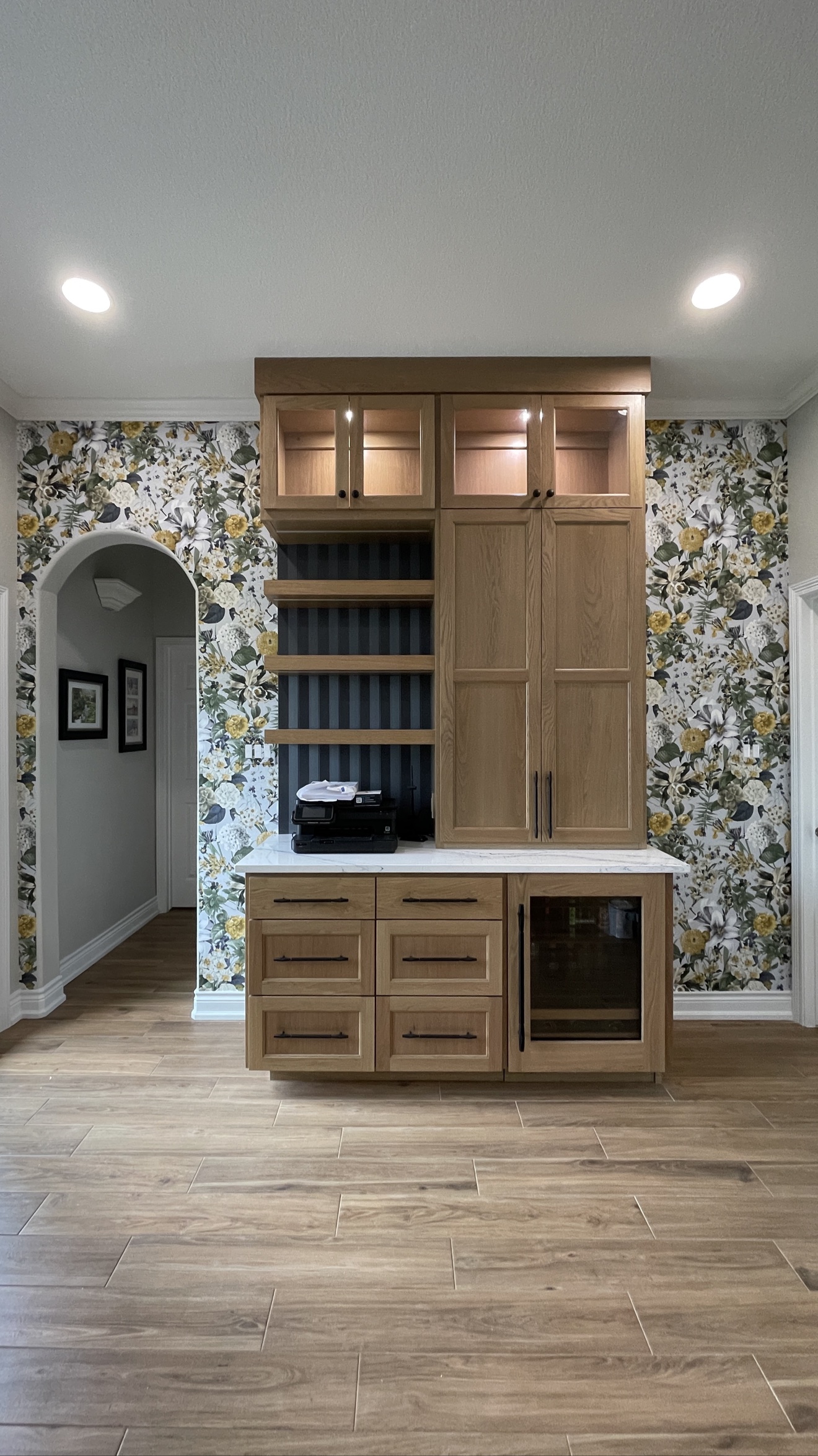 Yellow floral wallpaper installed in a home office