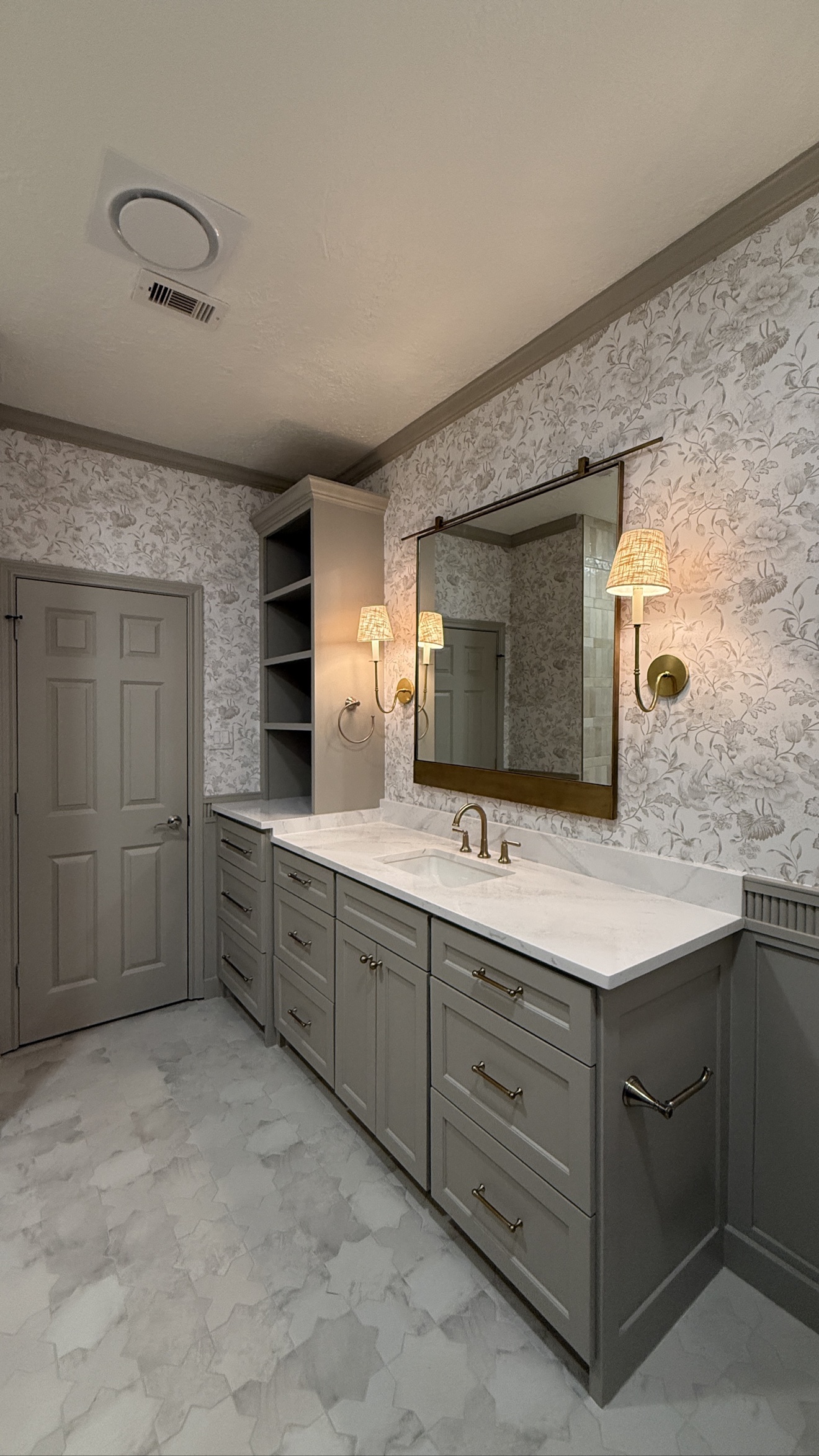 Light floral wallpaper installed in a bathroom